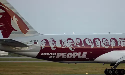 Qatar Airways Cargo freighter sports Moved by People livery Qatar Airways Cargo freighter sports Moved by People livery