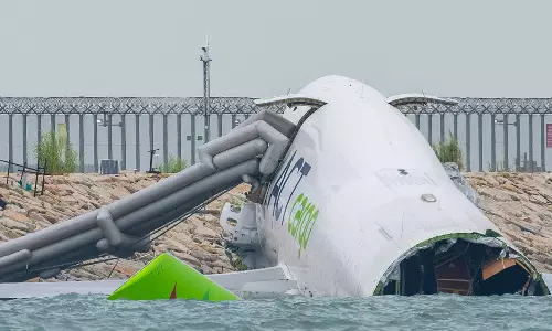 Freighter operated for Emirates crashes off Hong Kong runway; two dead